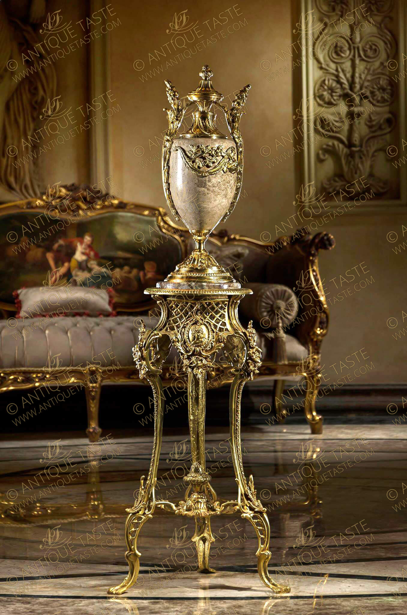 A French Louis XV finely chiseled gilt-ormolu Rococo style tripod Guéridon, The circular marble top inset in a beaded frieze above a pierced concave sides lattice apron centered to each side with a cartouche decorated with bas-relief cherub terminating with a rococo suspended acanthus leaf, The turning splayed legs headed with a bouquet of blossoming flowers and acanthus works, terminating with pierced design and acanthus leaves to each leg and connected with a leafy stretcher centered with an urn of prosperity